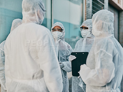Buy stock photo Health and safety personnel in protective gear ready to fight a virus, outbreak or pandemic. Hazmat wearing doctor, nurse and team or group of medical and healthcare professional at a quarantine site