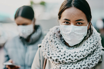 Buy stock photo Sick young covid patient, wearing medical face mask to stop the spread of virus pandemic. Woman standing outside in public crowd during viral coronavirus outbreak. Female taking healthcare precaution