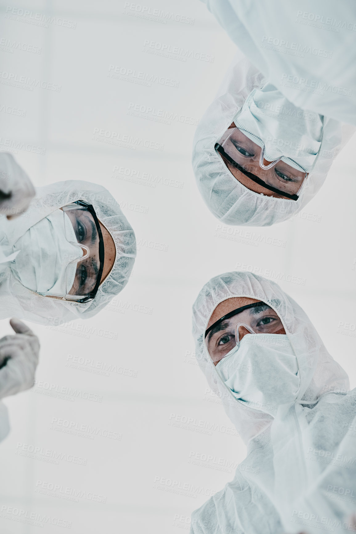 Buy stock photo Covid, pandemic and team doctors, scientists or medical workers wearing protective ppe to prevent spread of a virus from below. Virologist group wearing hazmat suit for plaque, ebola or disease 