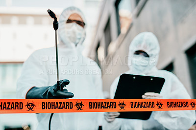 Buy stock photo Covid, pandemic and team of doctors, scientist or medical healthcare workers wearing hazmat suit to prevent the spread of virus at a quarantine site. First responders sterilizing the infected area.