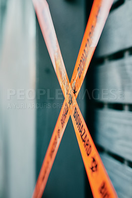 Buy stock photo Shot of barrier tape cordoning off a gate