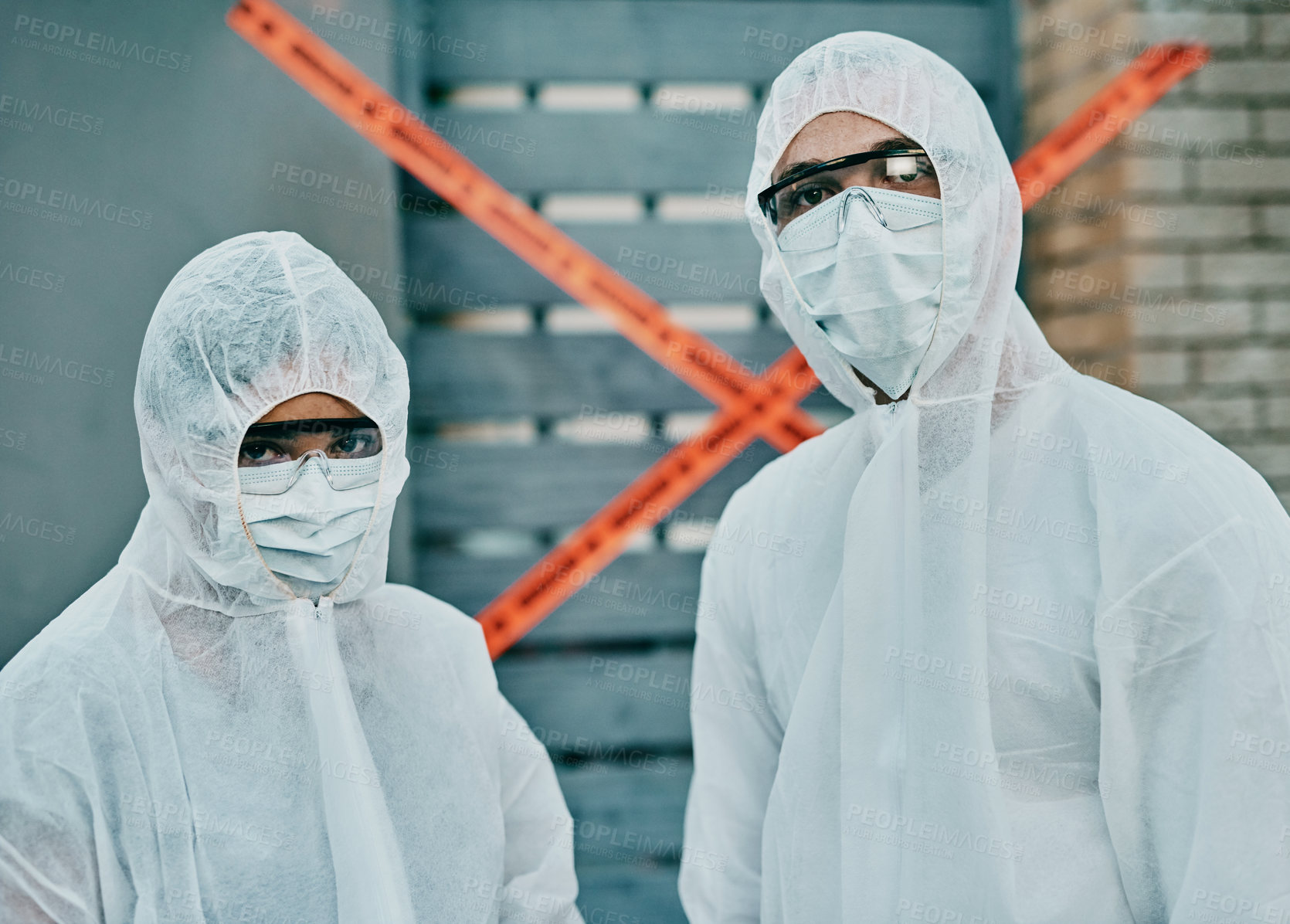 Buy stock photo Covid, coronavirus and outbreak healthcare workers inspecting contamination on site with red tape, protective masks and suits. Portrait of medical team working together to fight a contagious disease