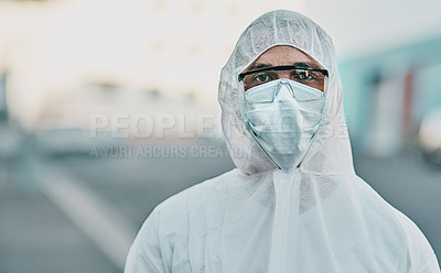 Buy stock photo Shot of a young man dressed in his protective gear before the decontamination process