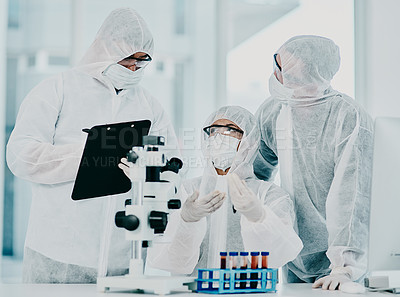 Buy stock photo Science and medical research doctors working on covid vaccine test while wearing protective hazmat suits in modern medicine laboratory. Group of healthcare scientists discussing blood treatment