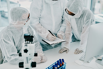Buy stock photo Team of scientists, pathologists and doctors in hazmat suits discussing forensic research and plans in a lab. Medical experts working on tests, experiments and drug trial to develop cure for disease