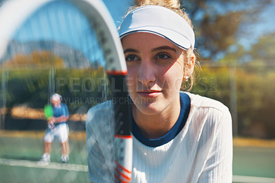 Buy stock photo Tennis, racket and face of woman on court for training, tournament match or game performance. Sports, athlete and person ready for exercise, workout and fitness determined for practice or competition