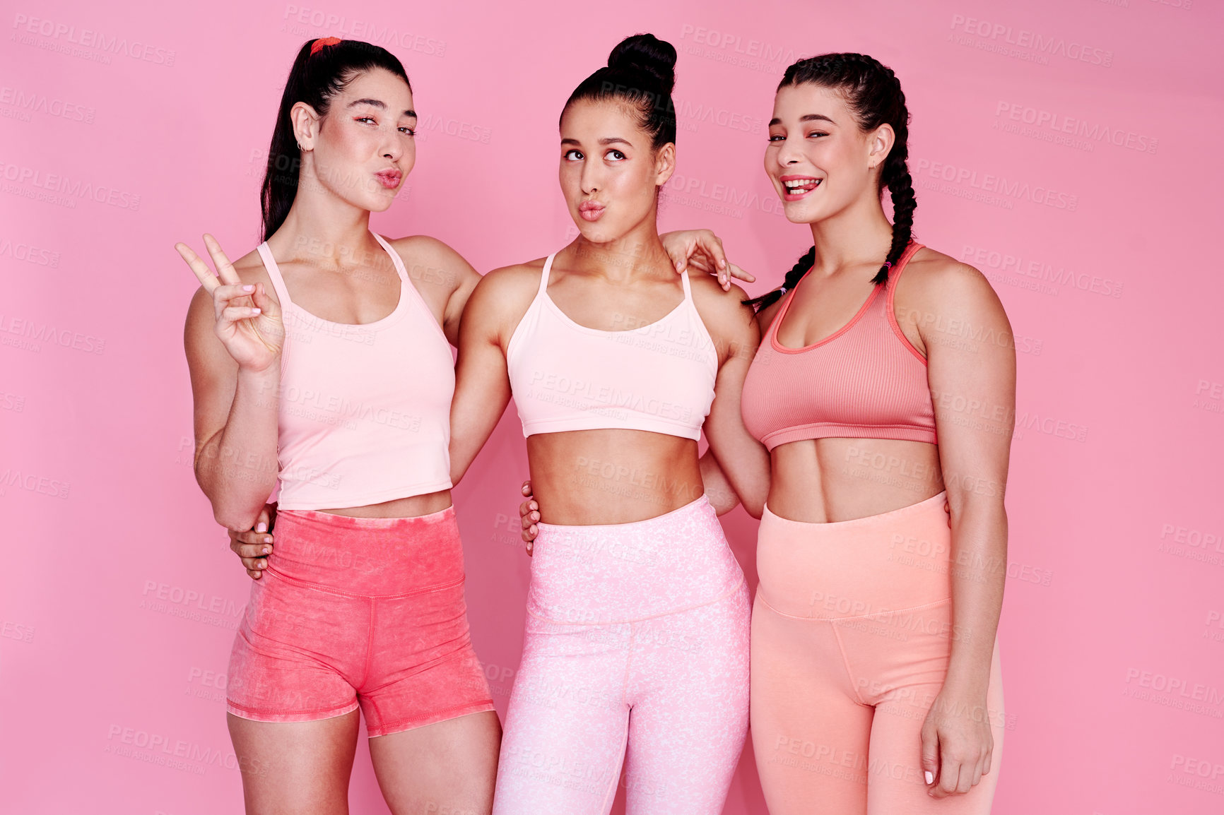 Buy stock photo Fitness, studio and portrait of women with pose for healthy body, exercise and workout together. Playful, pout and friends with peace sign by pink background for training, support and confidence