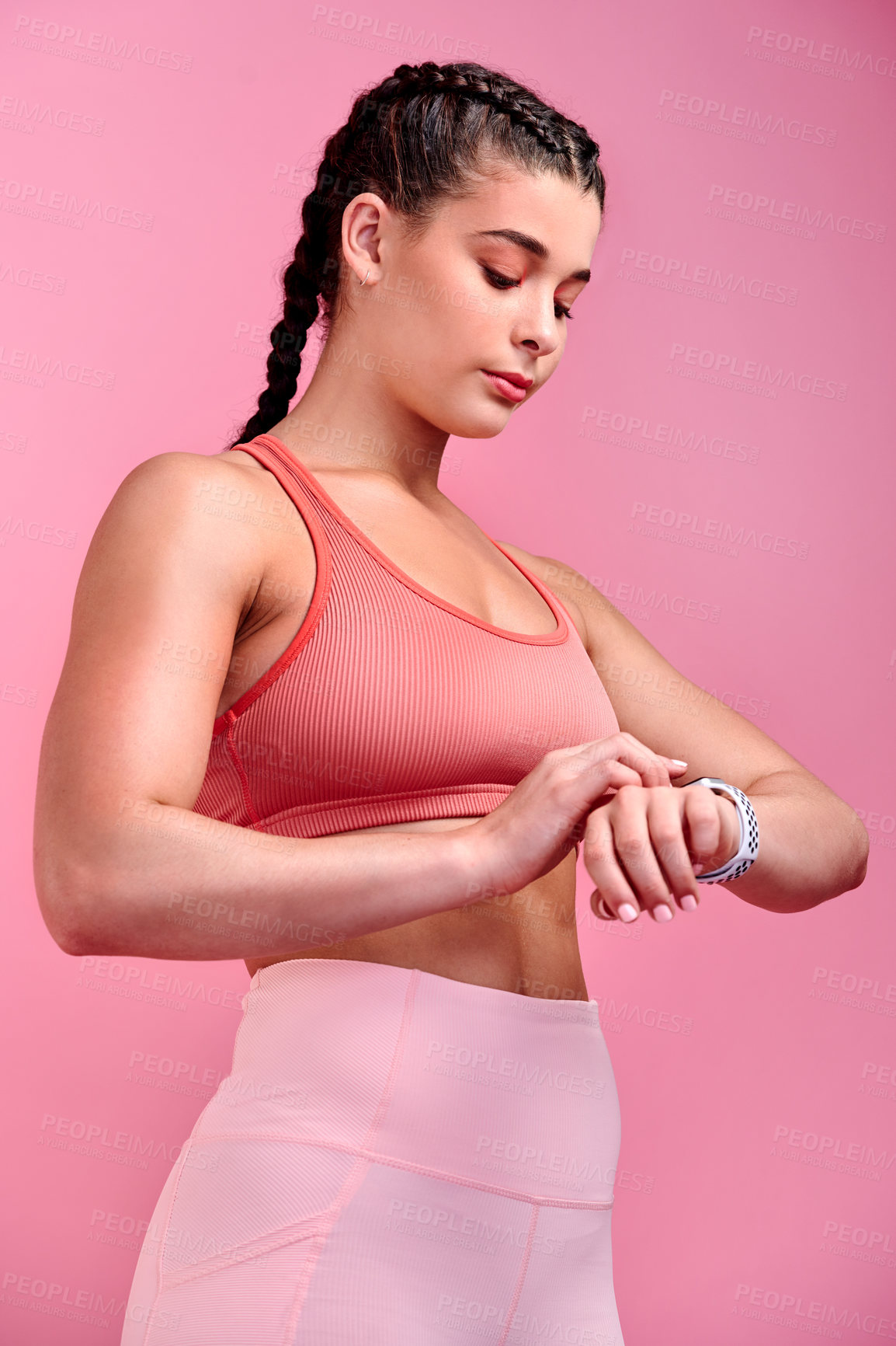 Buy stock photo Fitness, smart watch and health with woman in studio for wellness, goal tracking and challenge. Exercise, workout and training with person on pink background for muscle, performance and athlete