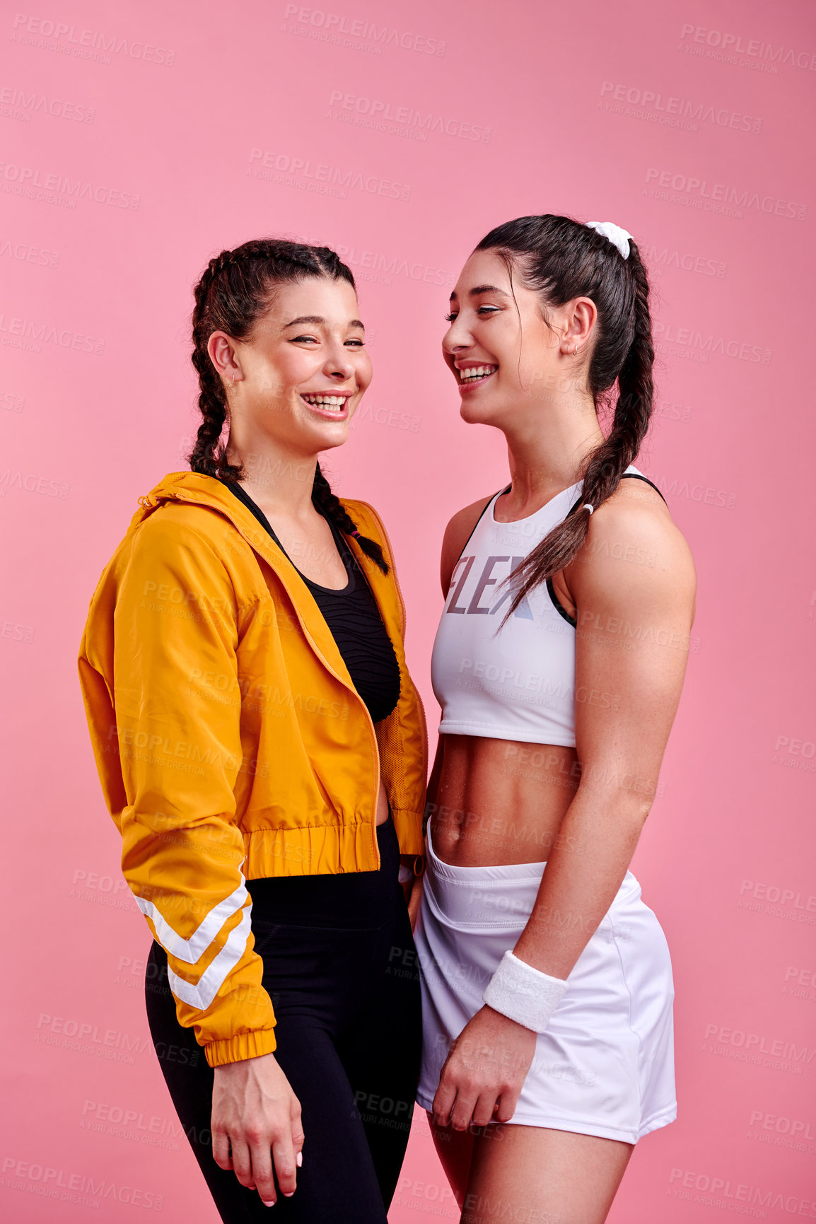 Buy stock photo Women, fitness and friends laughing in studio for exercise, workout or fashion on pink background. Happy girls, teenager and sports team together for healthy body, funny joke or training for wellness