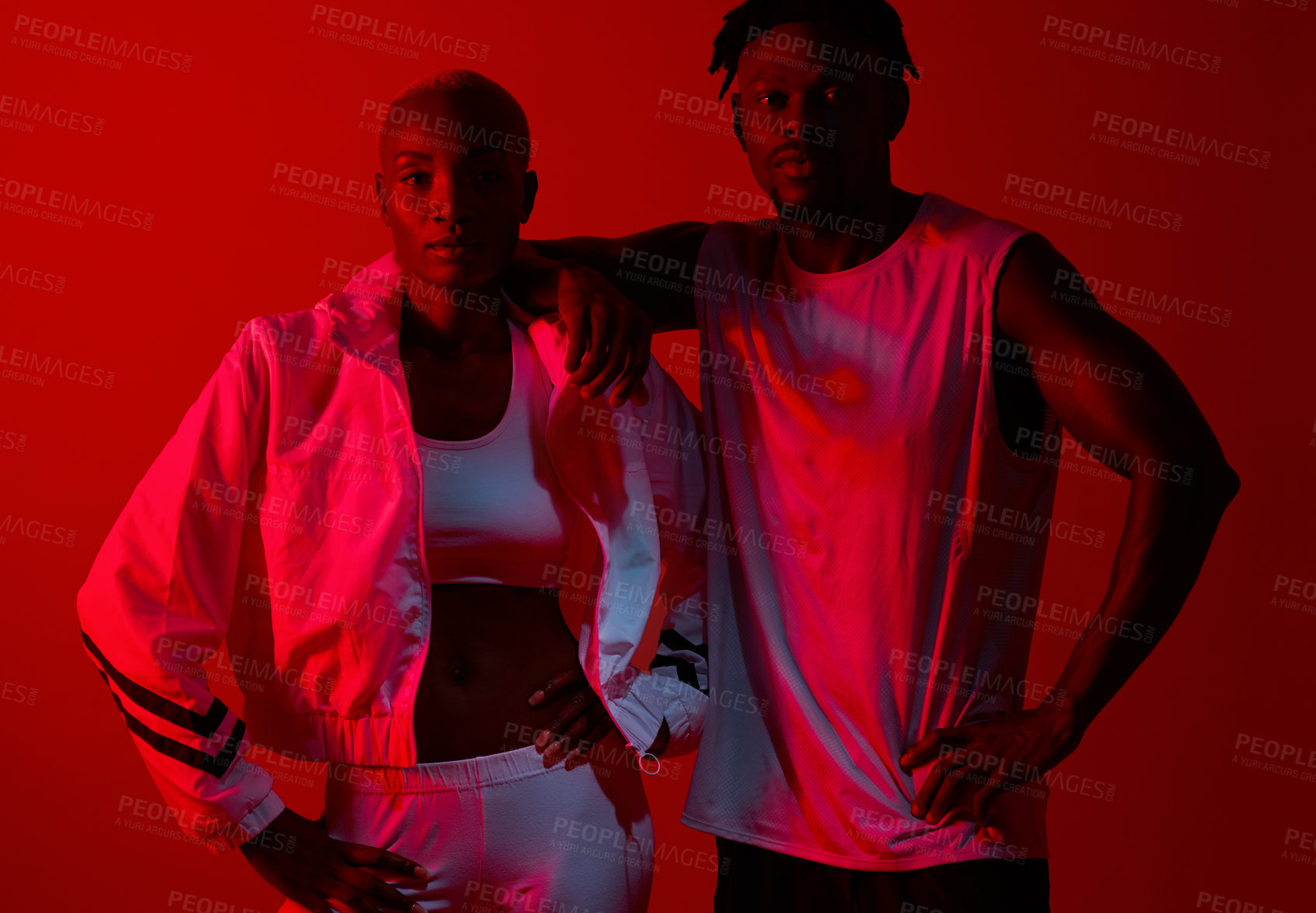 Buy stock photo Black couple, fashion and studio with red neon light for portrait in trendy tracksuit, style or confidence. People, man and woman with clothes, sportswear and pride for exercise, training and fitness