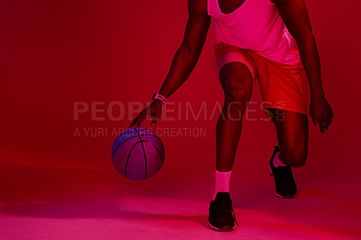 Buy stock photo Red filtered shot of an unrecognizable sportsman posing with a basketball in the studio
