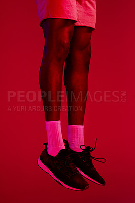 Buy stock photo Re filtered shot of an unrecognizable man wearing his workout sneakers
