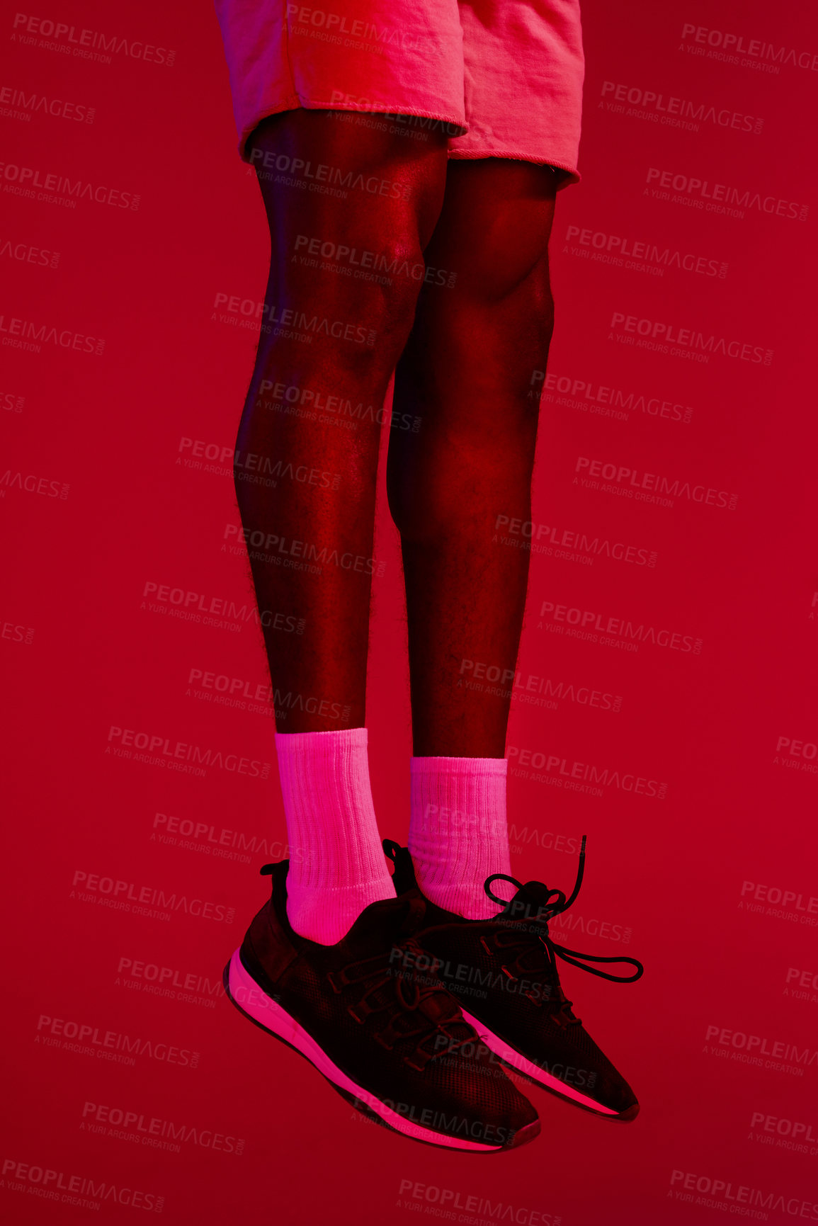 Buy stock photo Re filtered shot of an unrecognizable man wearing his workout sneakers