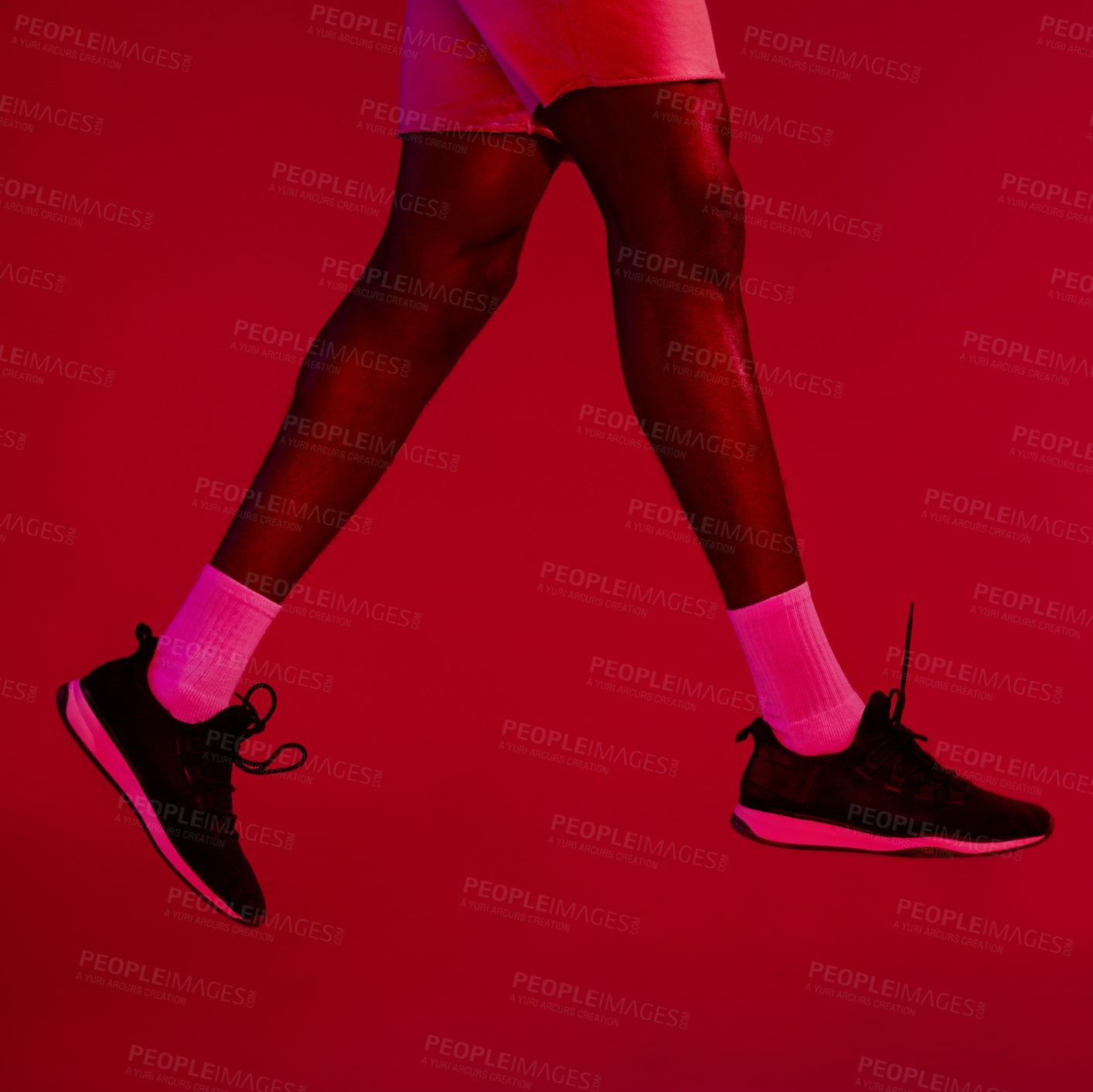 Buy stock photo Legs, sports or shoes in studio with athlete, fitness or gear for workout, fashion and training. Socks, footwear or person with sneakers for exercise performance on neon, closeup or red background