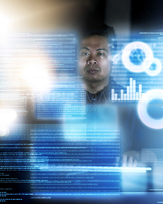 Buy stock photo Shot of a hacker cracking a computer code in the dark