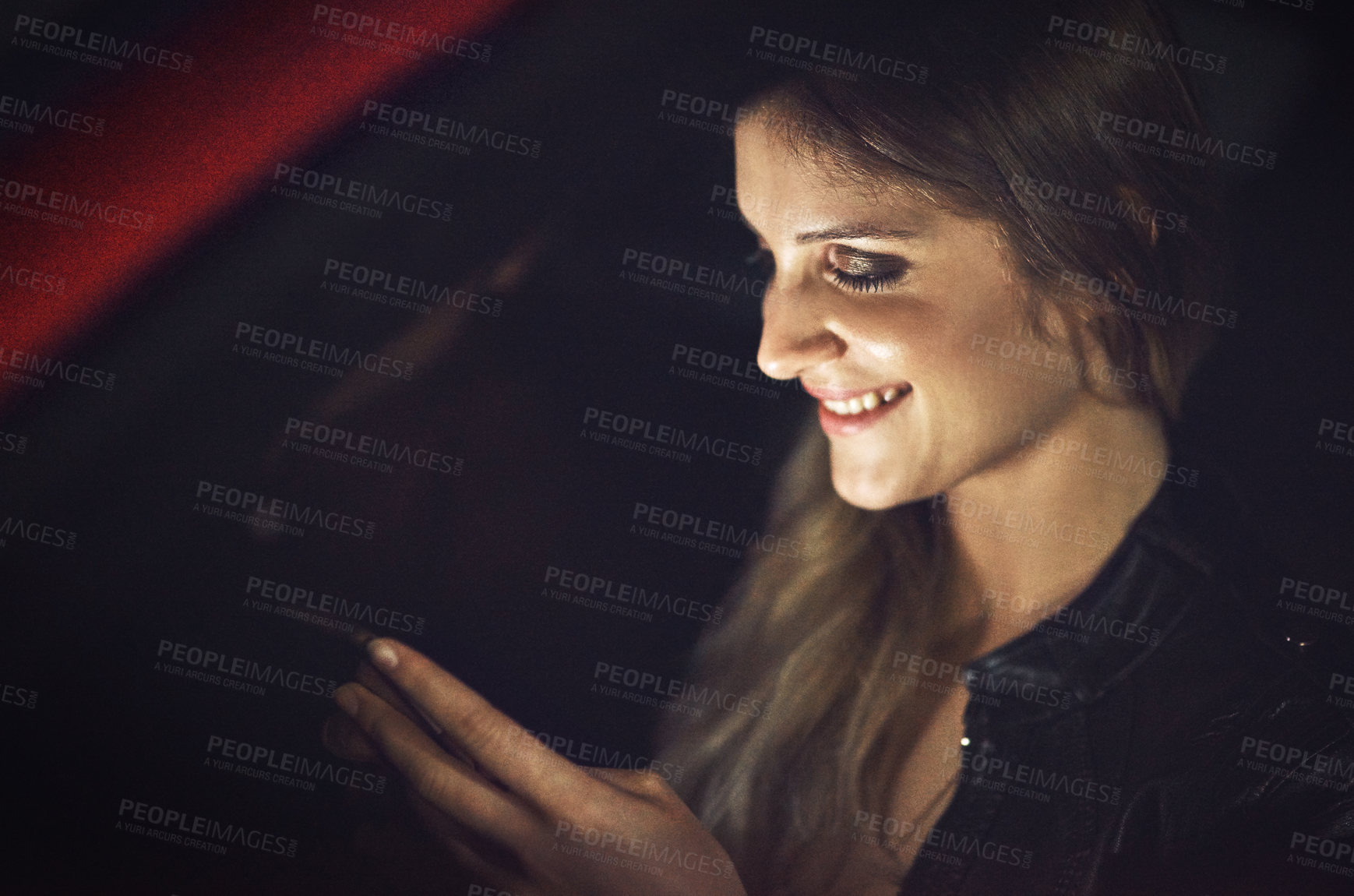 Buy stock photo Cropped shot of an attractive young female passenger sending a text message