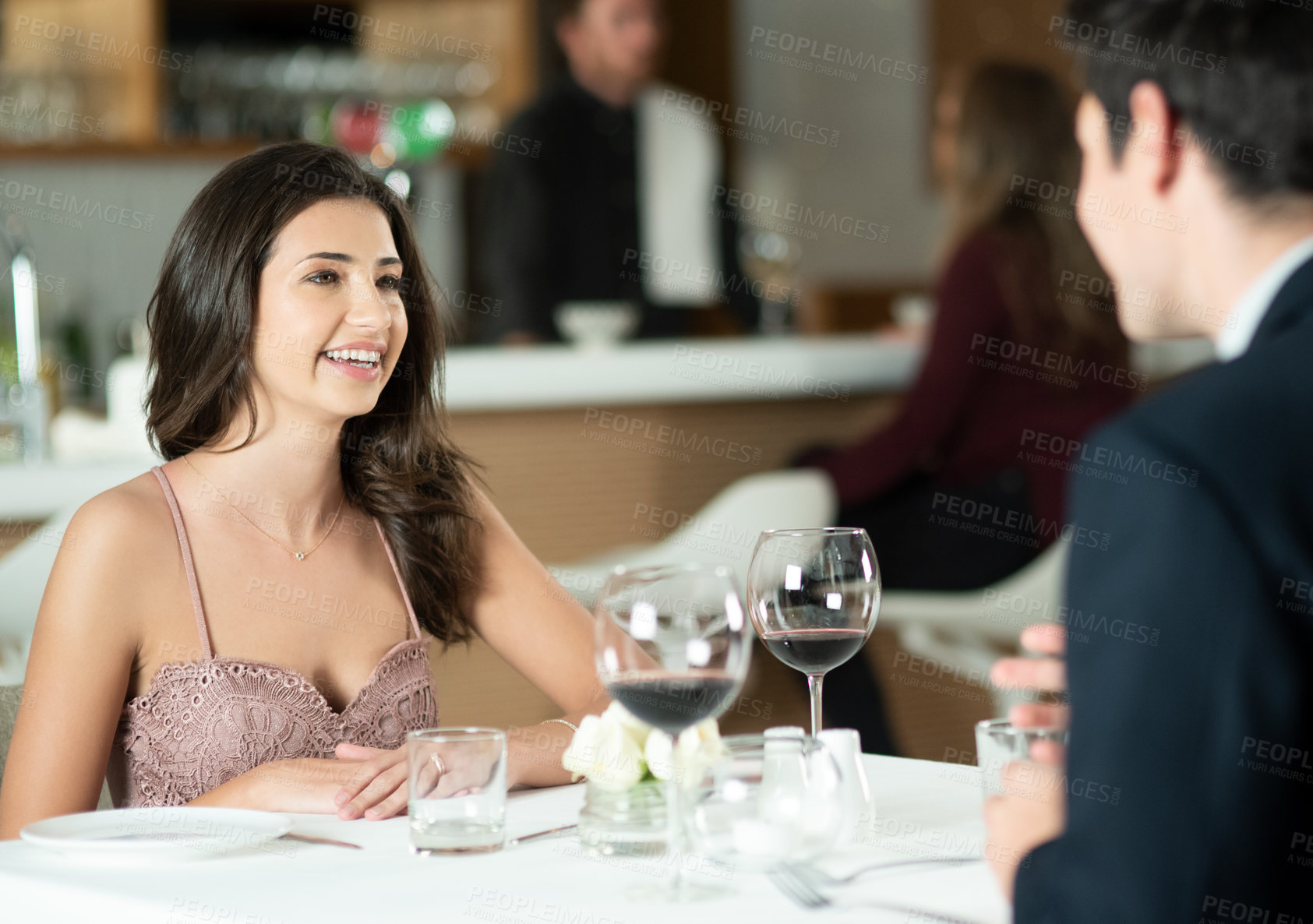 Buy stock photo Conversation, wine and couple on date at restaurant for romantic anniversary celebration dinner together. Happy, love and young man and woman with glass of alcohol drink in luxury diner for supper.