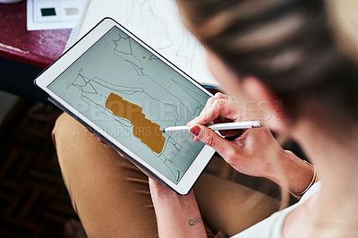 Buy stock photo Cropped shot of a fashion designer using a digital tablet to create new designs