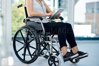 Buy stock photo Cropped shot of an unrecognizable businesswoman using a digital tablet in the office