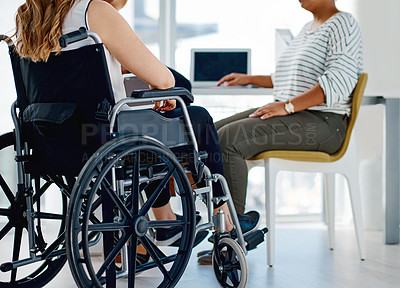 Buy stock photo Shot of a businesswoman with disabilities sitting with colleagues in the office