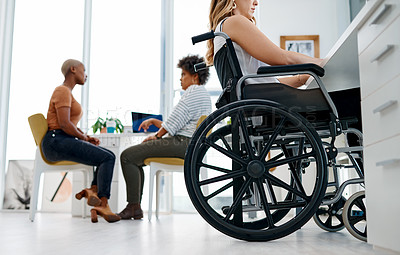 Buy stock photo Shot of a woman in a wheelchair working in a coworking space