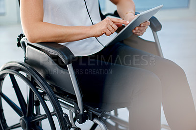 Buy stock photo Cropped shot of an unrecognizable businesswoman using a digital tablet in the office