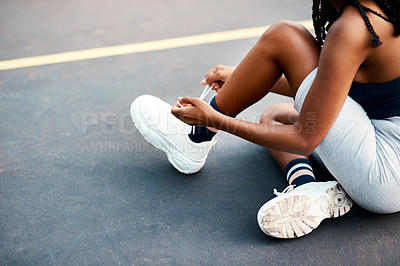 Buy stock photo Girl, sport and tying laces on basketball court or park for challenge, training or workout as athlete. Female person, shoes and outdoor for competition, match or game as physical activity or exercise