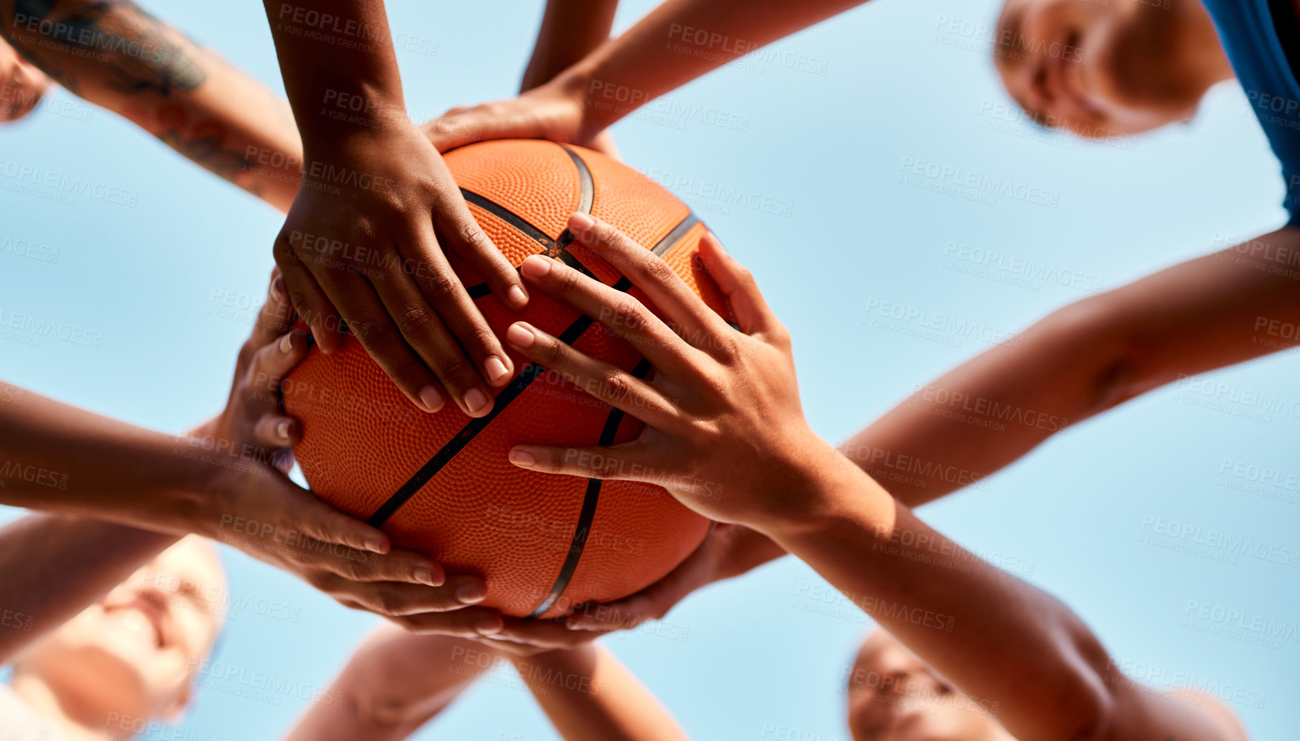 Buy stock photo Basketball, hands together and players with ball for fitness, support or motivation in outdoor activity. Sports game, huddle and group of people in low angle for teamwork, exercise or training match