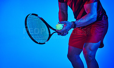 Buy stock photo Blue filtered shot of an unrecognizable tennis player getting ready to serve