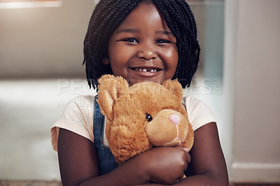 Buy stock photo Smile, portrait and black child in home with teddy bear, hug and playful with toy with happiness. Girl, comfort and companion with stuffed animal for childhood, sentimental value and friends in house