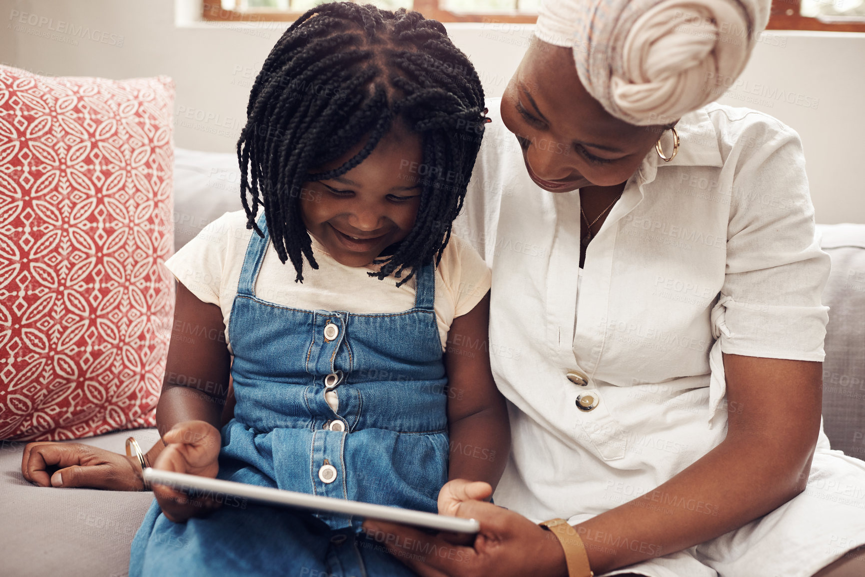 Buy stock photo Mother, child and tablet on sofa for e learning, education or development on weekend in living room. Digital, woman and black family with technology for app, subscription or playing game in home