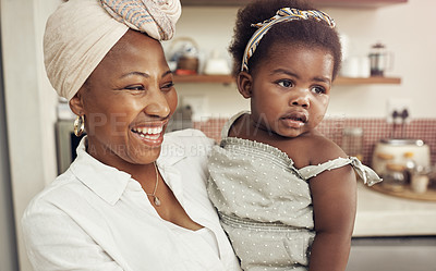 Buy stock photo Cropped shot of an adorable baby girl bonding with her mother at home