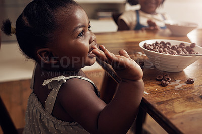 Buy stock photo Black child, cereal and eating in home kitchen for development, health and diet nutrition. Young girl, happy African baby and breakfast for morning food with growth, hungry and milk bowl by table