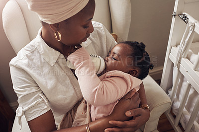 Buy stock photo Love, milk and bottle with mother and baby for care, nursing and morning. Smile, happiness and food with black woman and feeding newborn infant in family home for nutrition, wellness and growth 