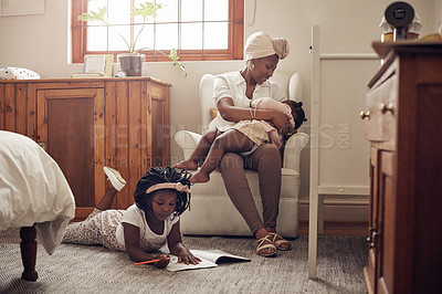 Buy stock photo Full length shot of a young mother bonding with her two adorable young daughters at home