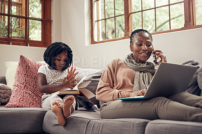Buy stock photo Black woman, phone call and laptop with child in home with book on a computer with remote work. Happy, kid and mobile connection of a girl reading with mama in a conversation from freelancer job