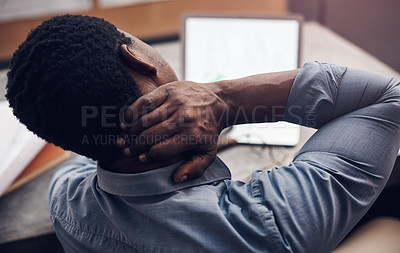 Buy stock photo Cropped shot of a handsome young male architect suffering with neck pain while working in a modern office