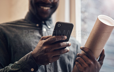 Buy stock photo Black man, hands and phone with blueprint in office for floor plan, research and communication. Employee, smile and contractor with tech at work for architecture news, feedback and update to client