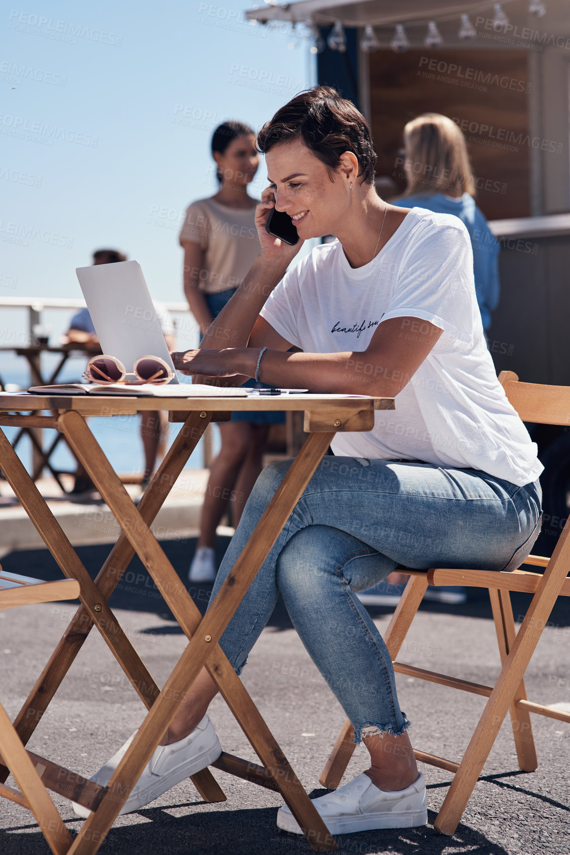 Buy stock photo Smile, phone call and woman with laptop, outdoor and restaurant in morning for scriptwriter with sunglasses. Summer, listening and happy with computer and paper for inspiration, web and creative