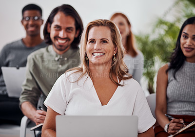 Buy stock photo Shot of a mature businesswoman attending a conference