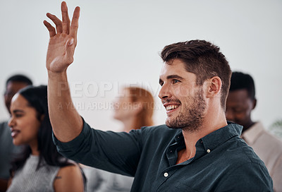 Buy stock photo Shot of a young businessman raising her hand during a conference