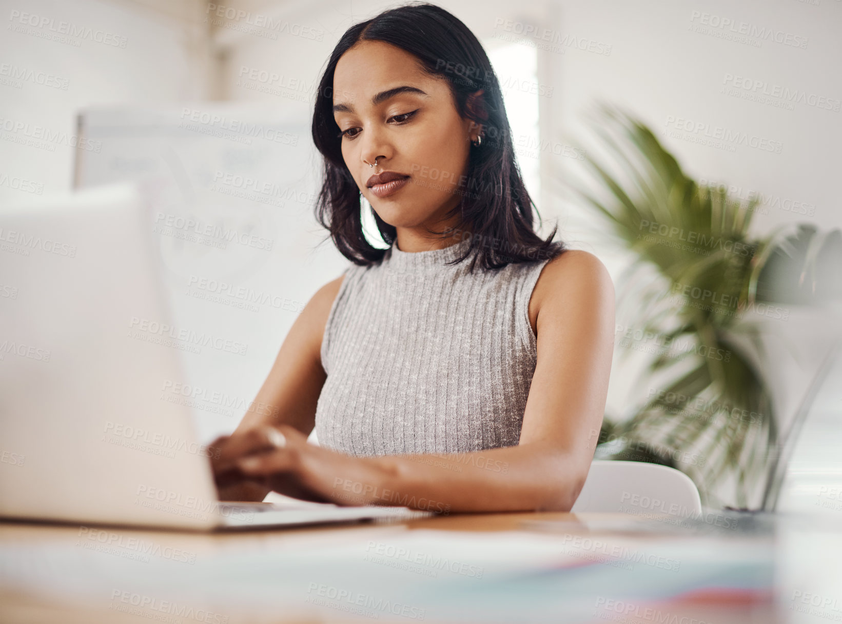 Buy stock photo Business woman, typing and laptop in modern office for research, writing email and planning schedule. Journalist, female person and computer for online news app, content creation and editing article