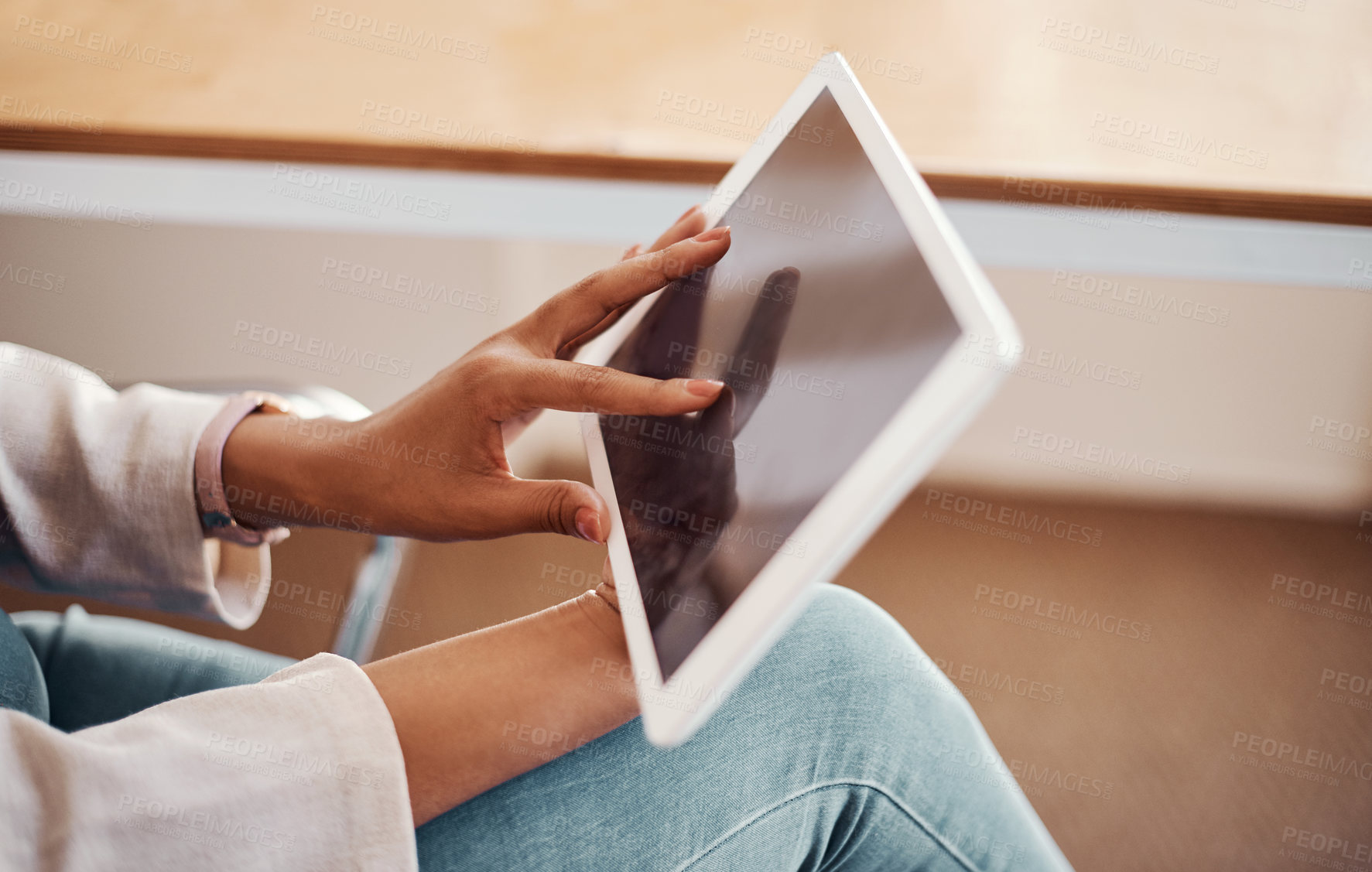 Buy stock photo Closeup shot of an unrecognisable businesswoman using a digital tablet in an office