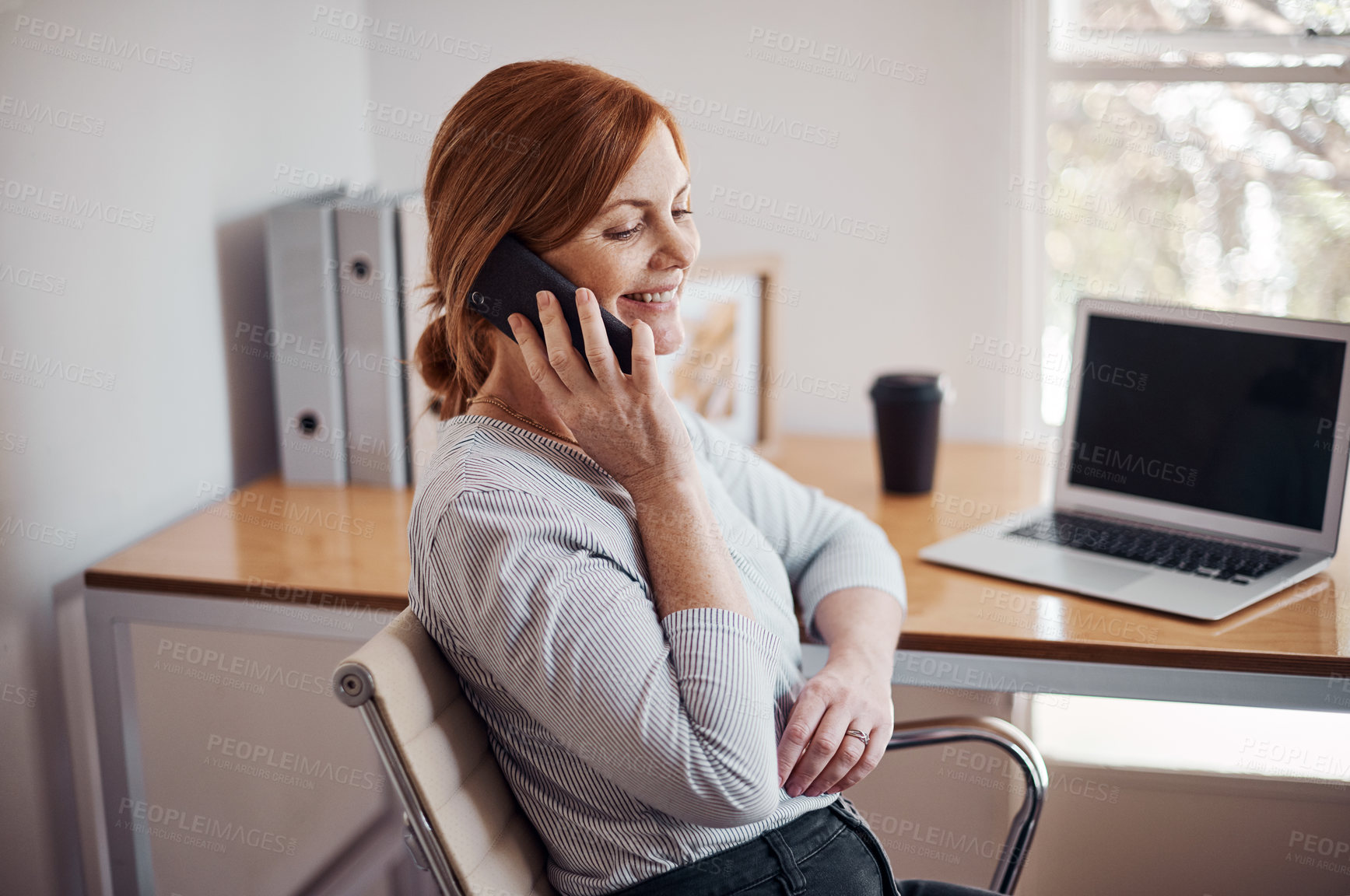 Buy stock photo Business woman, phone call and smile with laptop in home office of freelancer with networking and web research. Entrepreneur, communication and mobile with break and remote work for startup with chat