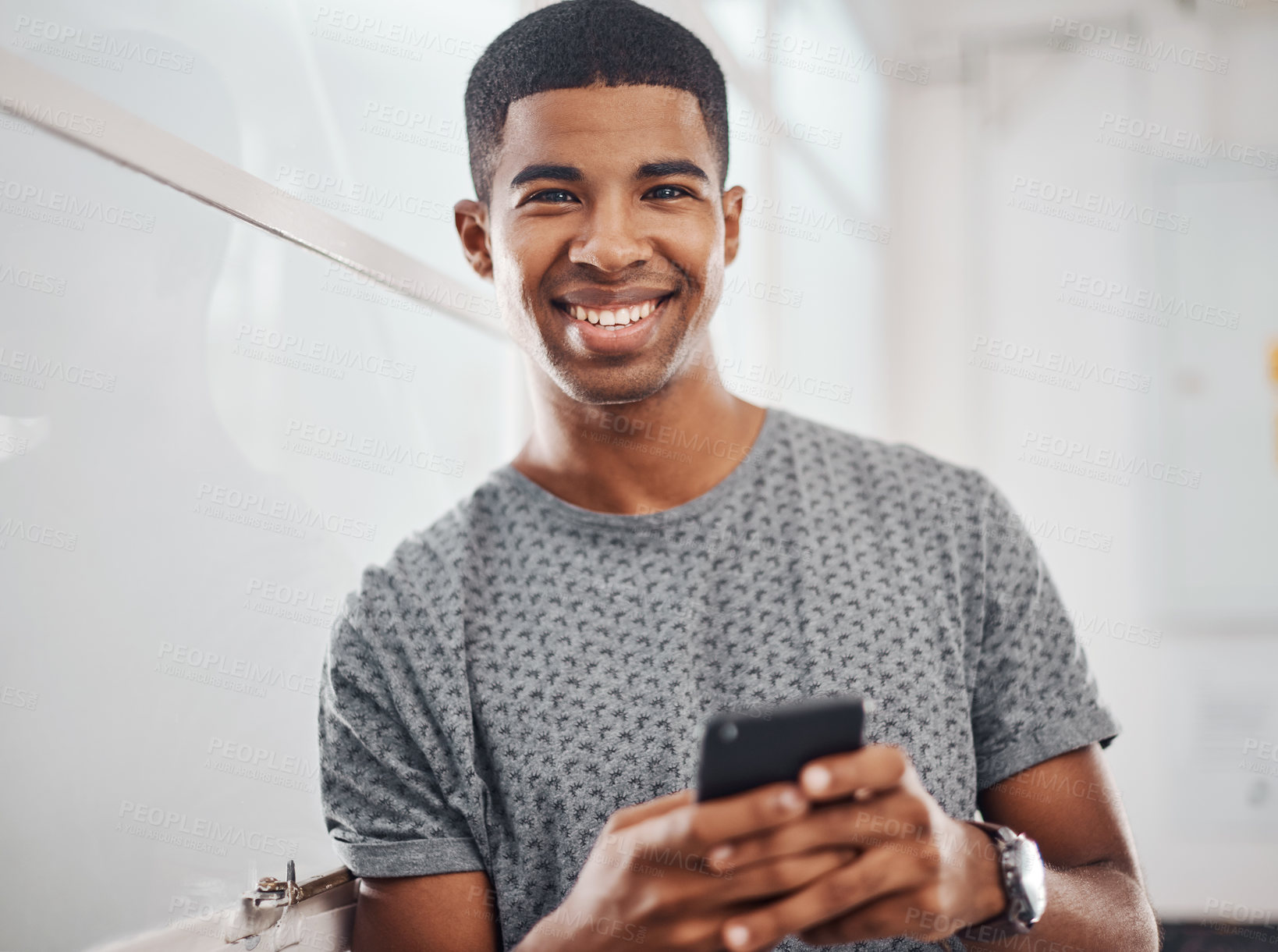 Buy stock photo Entrepreneur, portrait and phone in office for startup company, networking and career opportunity. Black man, happy and smartphone in workplace with motivation for partnership, growth and ambition