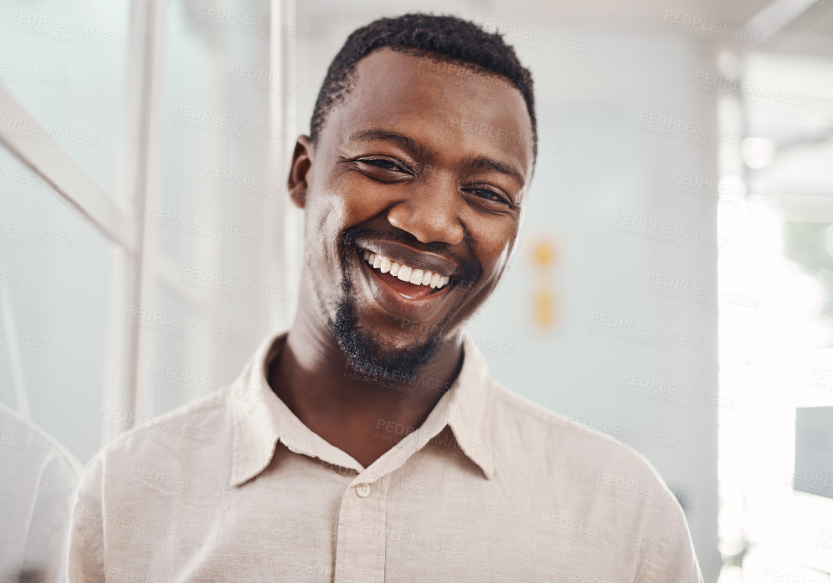 Buy stock photo Laughing, portrait and smile with business man in office for corporate or professional career. Face, funny and happy with confident African employee in company workplace for comedy, humor or joke