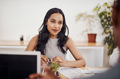 Buy stock photo Shot of a young businesswoman having a meeting with a colleague in an office