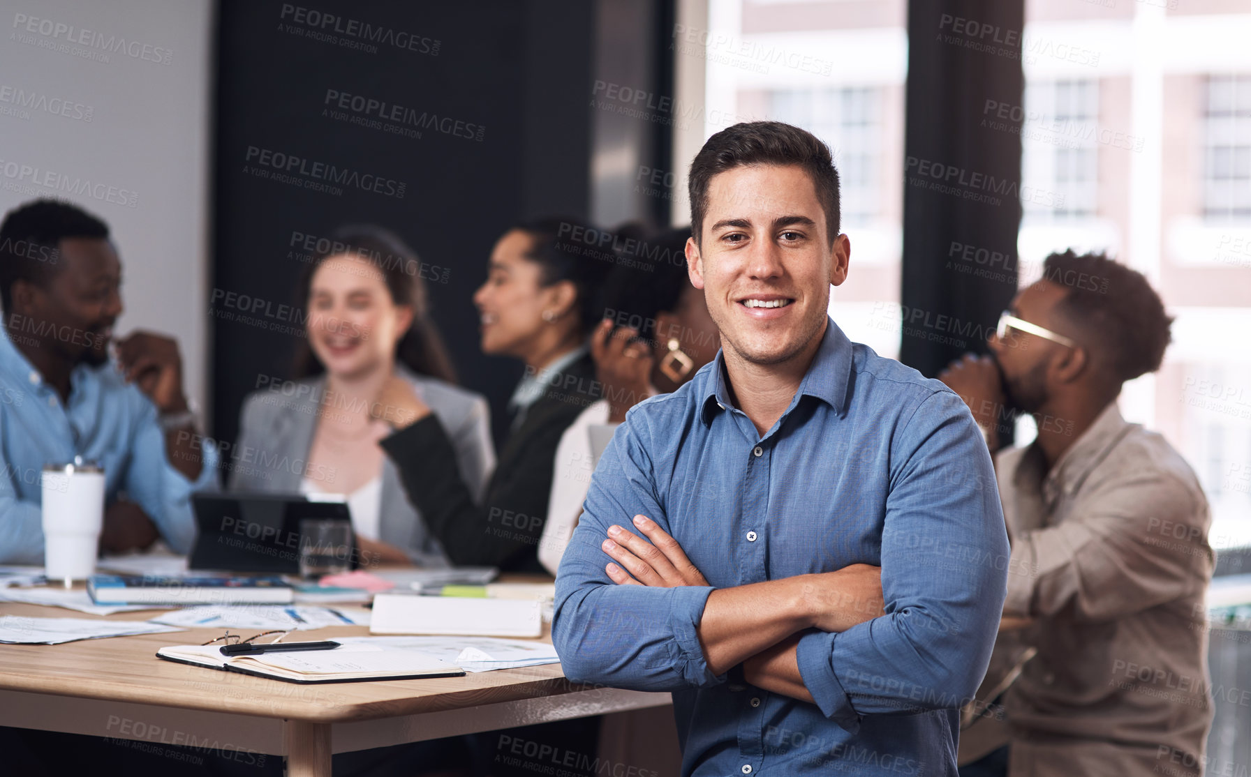 Buy stock photo Businessman, arms crossed and meeting portrait for teamwork, paperwork and planning in office. Employee guy, confidence and collaboration with project documents, strategy discussion and growth report