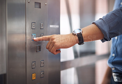 Buy stock photo Closeup shot of an unrecognisable man pushing a button in an elevator