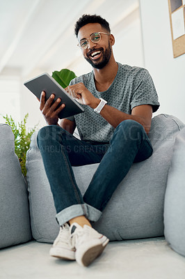 Buy stock photo Happy, man and tablet on bean bag for portrait, contact or company website update in office. Creative person, technology or business on furniture for communication, customer request or social media